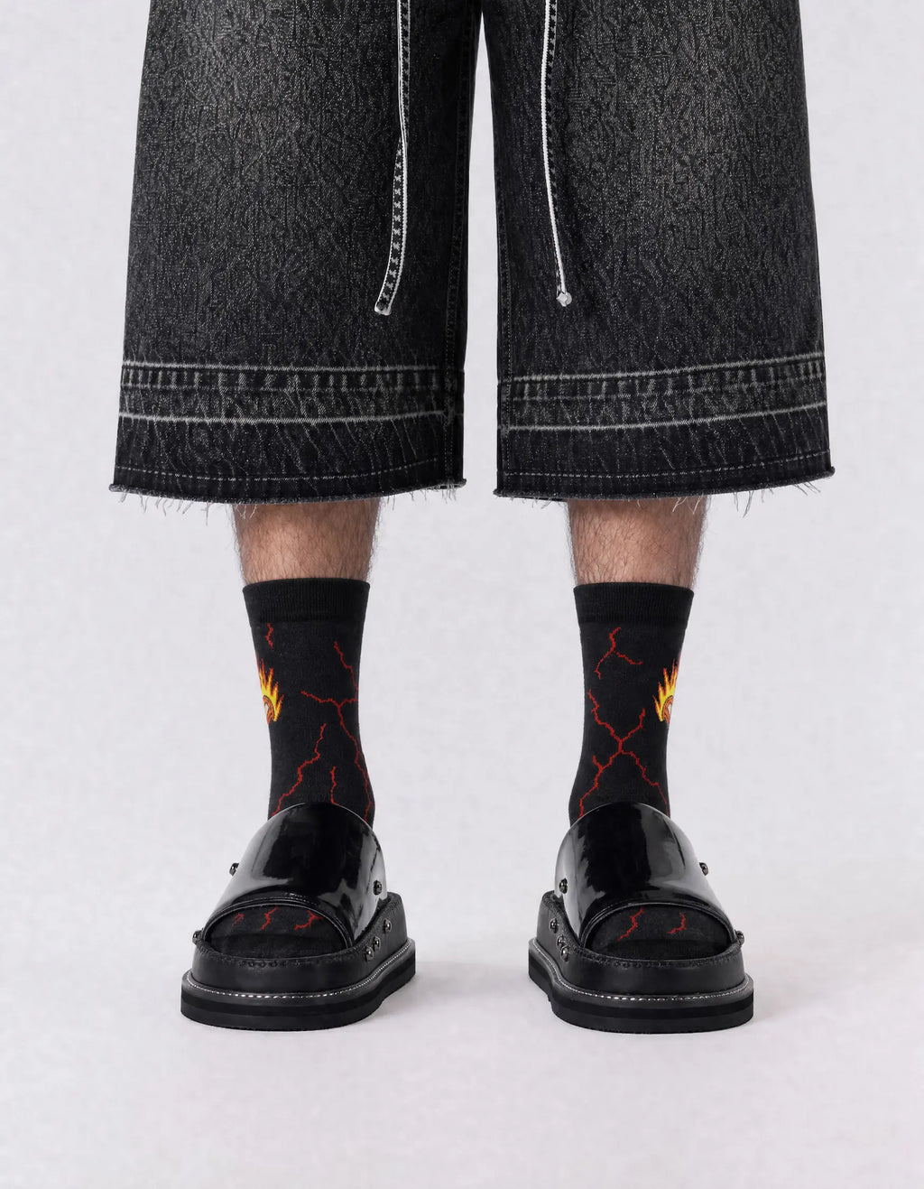 Men's black fire crew socks with lightning graphics - front view