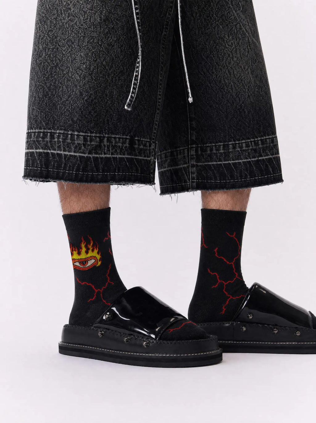 Women's black fire crew socks with lightning graphics - side view