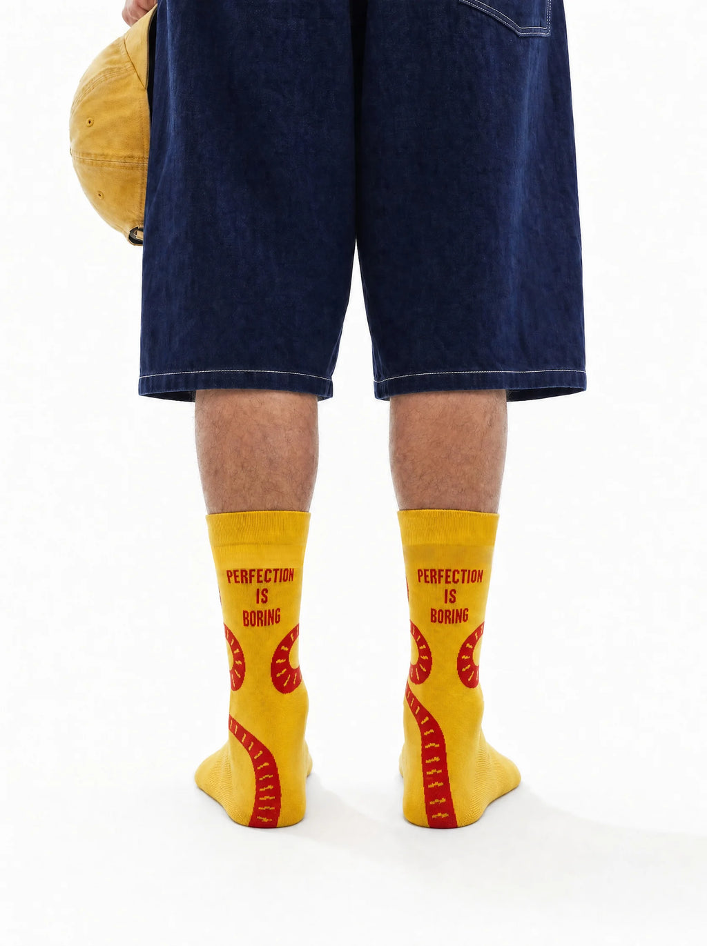 Men's yellow crew socks with red snake design - back view
