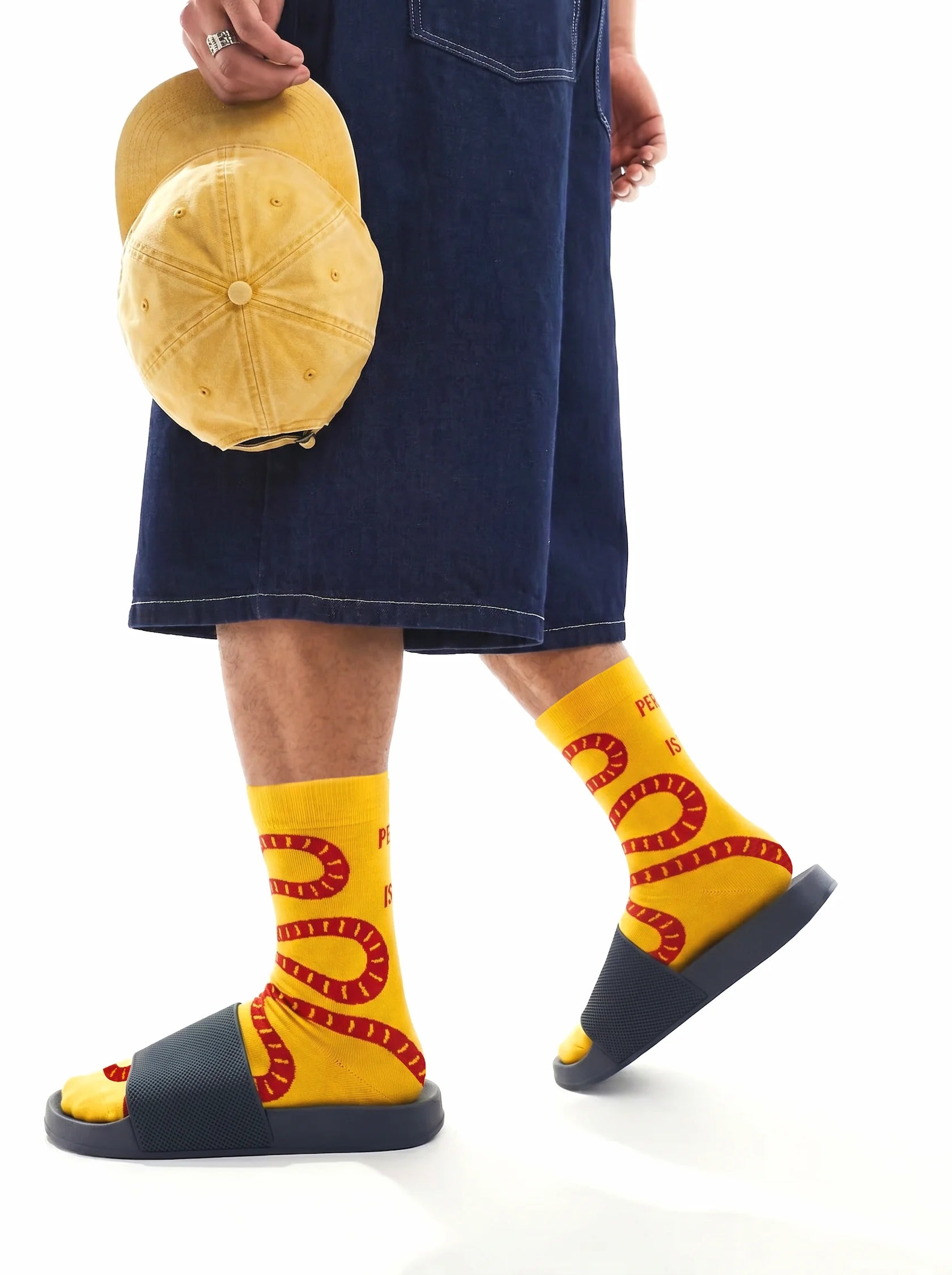 Men's yellow crew socks with red snake design side view 2